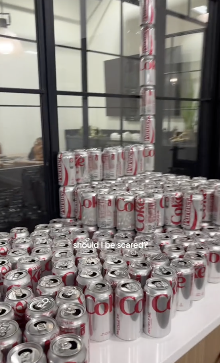 a pile of diet coke cans